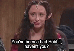 A Woman With Elf Ears Is Wearing A Headset And Talking On A Phone . GIF