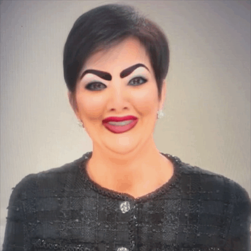 A Woman With Fake Eyebrows And Red Lips Is Wearing A Black Shirt GIF