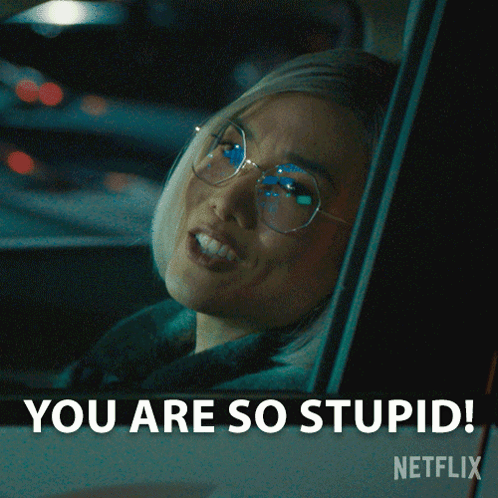A Woman With Glasses Is Sitting In A Car And Says You Are So Stupid GIF