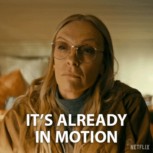 A Woman With Glasses Says It 'S Already In Motion On A Netflix Ad GIF