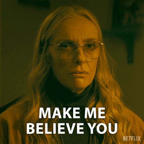 A Woman With Glasses Says Make Me Believe You On A Netflix Poster GIF