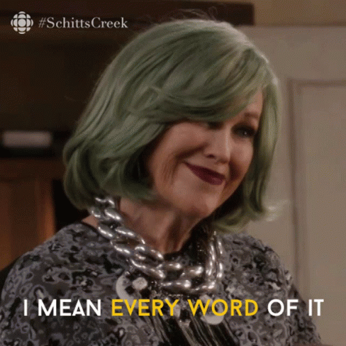 A Woman With Green Hair And A Necklace Says I Mean Every Word Of It GIF