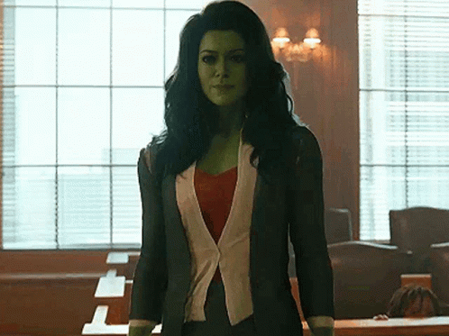 Woman With Green Hair And Skin In Courtroom GIF