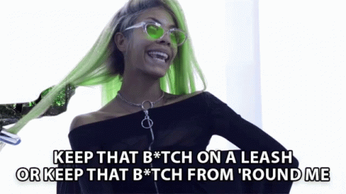 A Woman With Green Hair And Sunglasses Says Keep That B * Tch On A Leash Or Keep That B * Tch From ' Round Me GIF