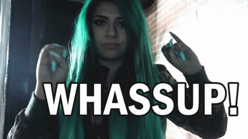 A Woman With Green Hair Is Giving The Middle Finger And The Words Whassup Are Above Her GIF