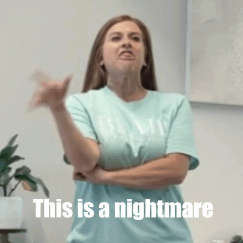 A Woman With Her Arms Crossed And The Words This Is A Nightmare Above Her GIF