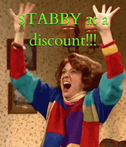 A Woman With Her Arms In The Air With The Words Stabby At A Discount Written Below Her GIF