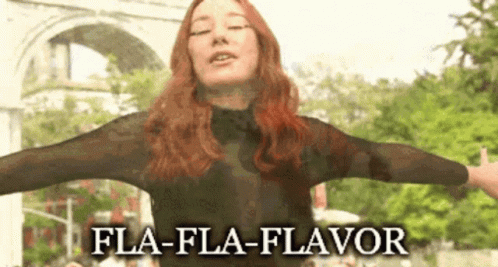 Woman With Arms Outstretched And Fla-Fla-Flavor Text GIF