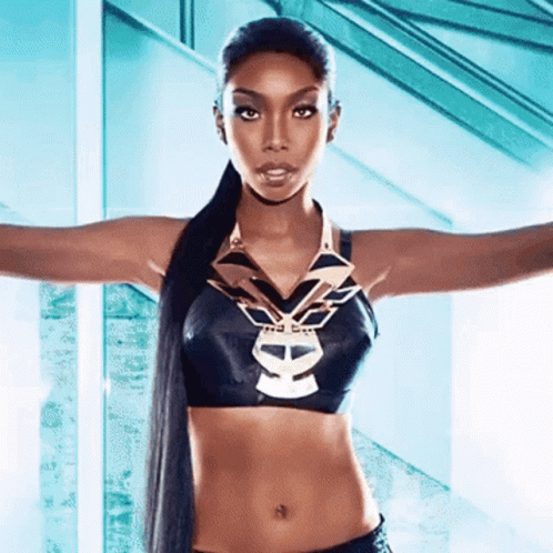 Woman In Black Crop Top With Skull And Necklace GIF