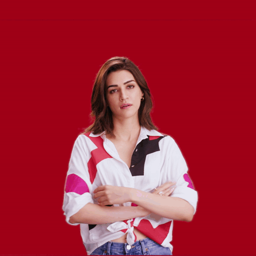 A Woman With Her Arms Outstretched Looks Surprised GIF