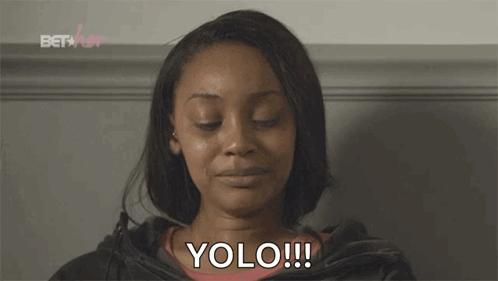 A Woman With Her Eyes Closed And The Word Yolo Written On Her Face GIF