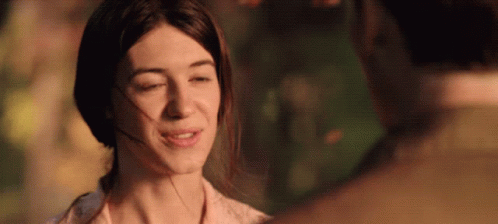 A Woman With Her Eyes Closed Looks At A Man With His Eyes Closed GIF