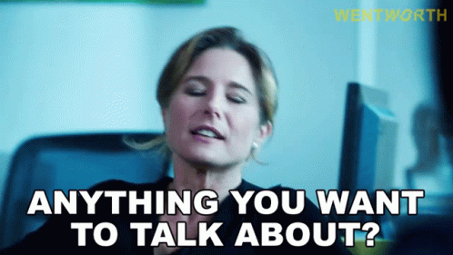 A Woman With Her Eyes Closed Says " Anything You Want To Talk About " GIF