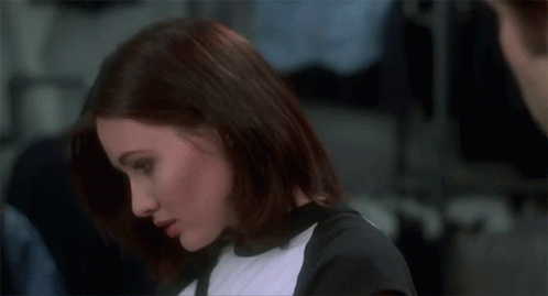 A Woman With Her Eyes Closed Says " For What " In Front Of A Man GIF