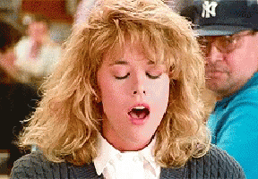 A Woman With Her Eyes Closed Wearing A Ny Baseball Cap GIF