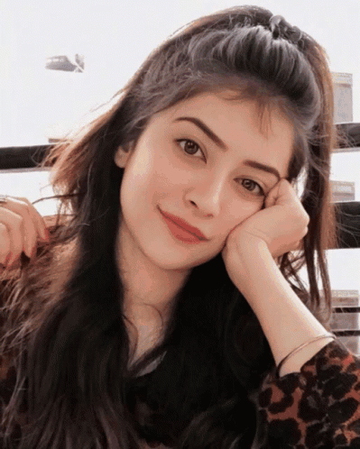 A Woman With Her Head Resting On Her Hand GIF