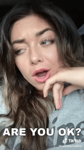 A Woman With Her Mouth Open And The Words Are You Ok Written Above Her GIF