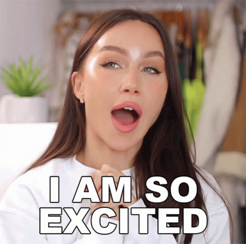 A Woman With Her Mouth Open And The Words I Am So Excited Behind Her GIF