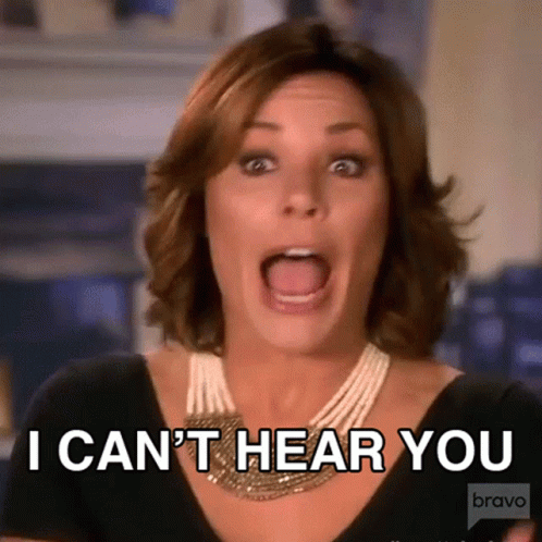 A Woman With Her Mouth Open And The Words I Can 'T Hear You Behind Her GIF