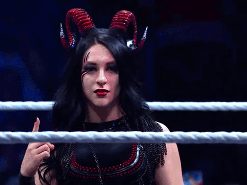A Woman With Horns Is Giving A Thumbs Up Sign GIF