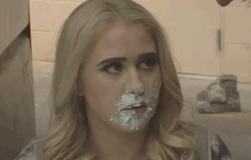 A Woman With Icing On Her Face Says I Ate The Baby GIF