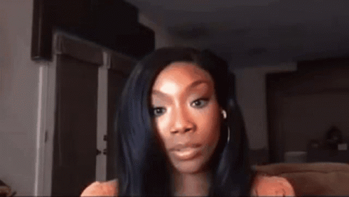 Woman With Long Black Hair Looking At Camera GIF