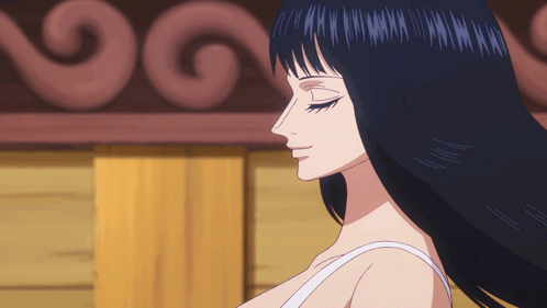 a woman with long black hair is wearing a white top