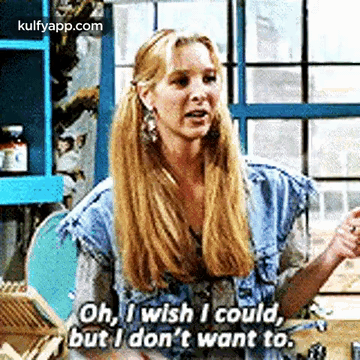 A Woman With Long Blonde Hair Is Sitting At A Table And Talking To A Man . GIF
