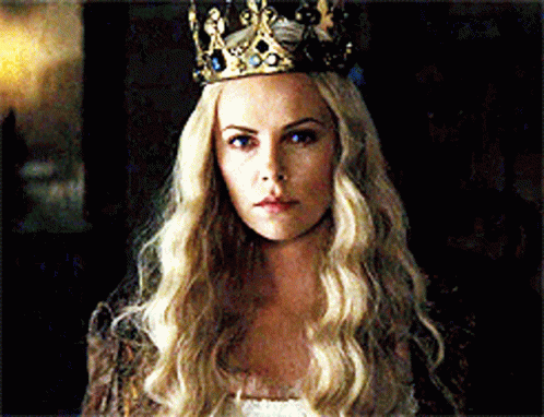 A Woman With Long Blonde Hair Wearing A Crown On Her Head GIF