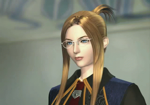 A Woman With Long Blonde Hair Wearing Glasses And A Blue Jacket GIF
