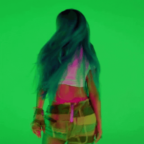 A Woman With Long Blue Hair Is Dancing On A Green Background GIF