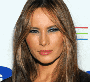 A Woman With Long Brown Hair And Blue Eyeshadow GIF