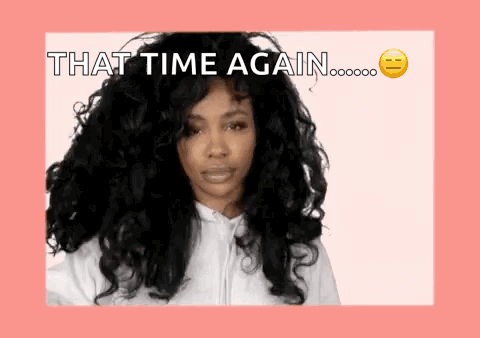 A Woman With Long Curly Hair Is Wearing A White Hoodie And Says That Time Again . GIF