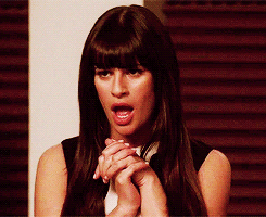 A Woman With Long Dark Hair Is Making A Funny Face GIF