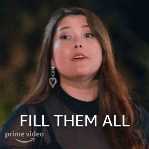 A Woman With Long Hair And Earrings Says Fill Them All On A Prime Video Ad GIF