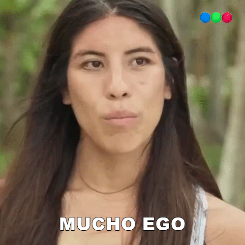 A Woman With Long Hair Is Making A Funny Face And The Words Mucho Ego Are On Her Face GIF