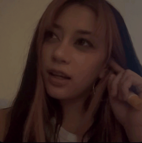 A Woman With Long Hair Making A Funny Face GIF