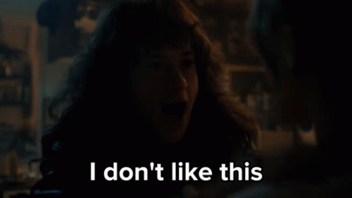 A Woman With Long Hair Says I Don 'T Like This In A Dark Room GIF