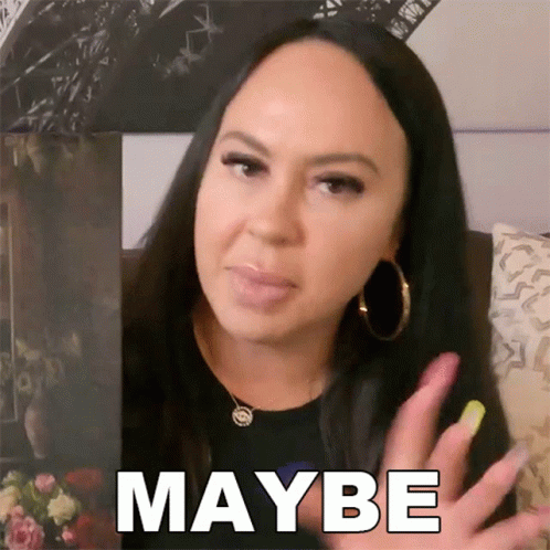 A Woman With Long Nails Says Maybe In Front Of Her Face GIF