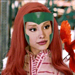 A Woman With Long Red Hair And A Green Helmet On Her Head GIF