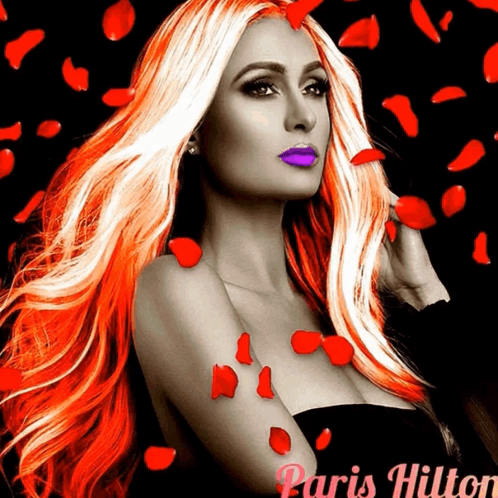 A Woman With Long Red Hair And Purple Lips Is Surrounded By Red Rose Petals And The Name Paris Hilton GIF