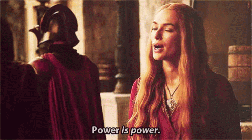 A Woman With Long Red Hair Is Saying Power Is Power GIF