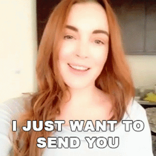A Woman With Long Red Hair Is Smiling And Says I Just Want To Send You GIF