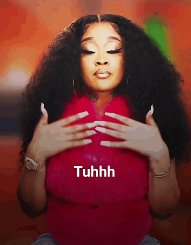 A Woman With Long White Nails Is Wearing A Red Shirt That Says Tuhhh On The Bottom GIF
