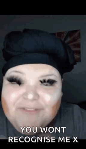 A Woman With Makeup On Her Face Is Smiling And Says `` You Won T Recognise Me X '' . GIF