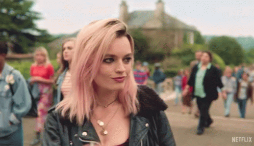 A Woman With Pink Hair And A Netflix Logo On The Bottom GIF