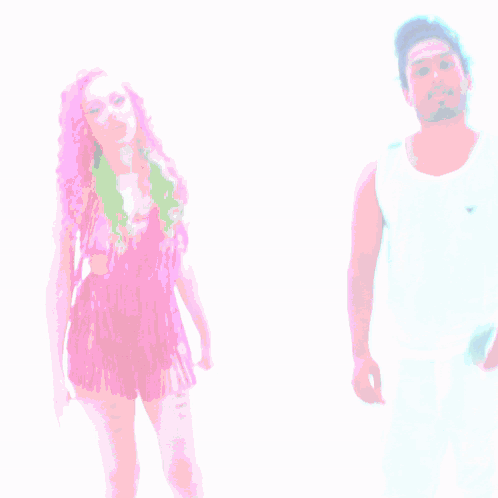 A Woman With Pink Hair Is Standing Next To A Man With White Pants GIF