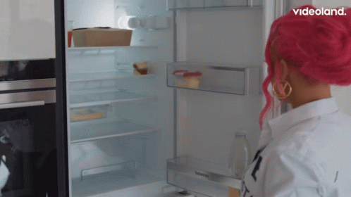 A Woman With Pink Hair Opens A Siemens Refrigerator Door GIF