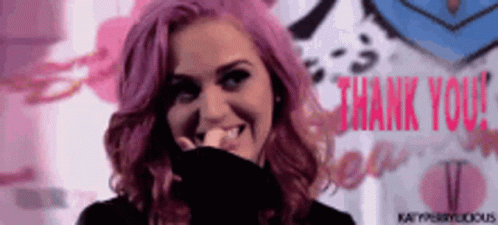 A Woman With Pink Hair Says Thank You In Red Letters GIF