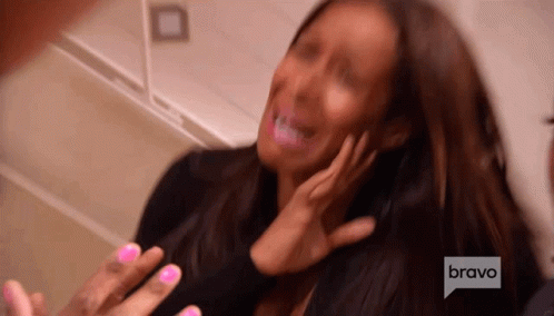 A Woman With Pink Nails Is Being Interviewed By A Man On Bravo GIF